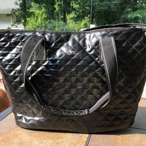 Scout Tote black with snap closer, two handles and two pockets on the inside